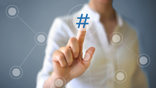 person touches hashtag icon