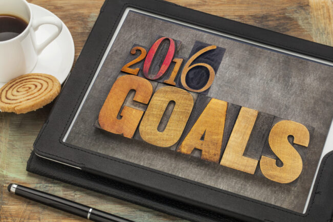 Text on Tablet: "2016 Goals"