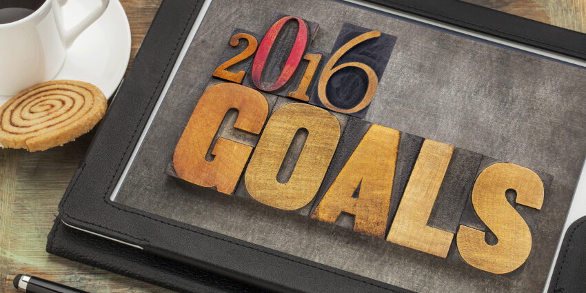 Text on Tablet: "2016 Goals"