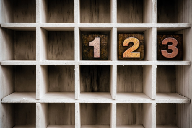 Wooden cube block shelf with wooden cubes reading "1," "2," "3."