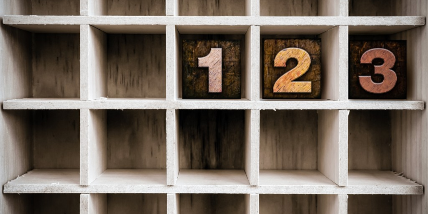 Wooden cube block shelf with wooden cubes reading "1," "2," "3."