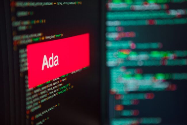 Red rectangle with white text: "Ada" in foreground; computer code in background