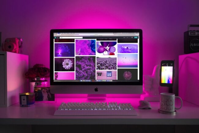 High-resolution pink-hued photographs in four columns on an apple computer