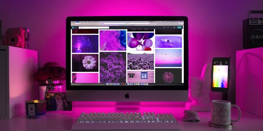 High-resolution pink-hued photographs in four columns on an apple computer