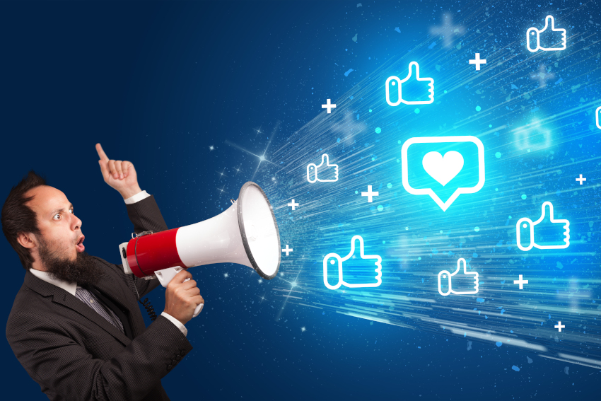 Young person yellin in loudspeaker with speech bubble with a heart icon, social networking concept