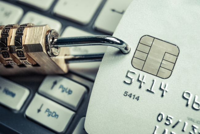Padlock attached to a credit card to represent security while shopping online