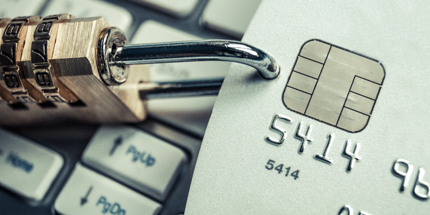 Padlock attached to a credit card to represent security while shopping online