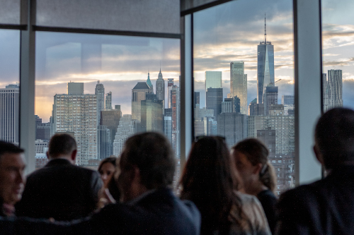 Large windows show skyline of New York City