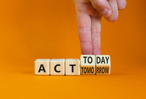 Wooden blocks reading "act today, not tomorrow"
