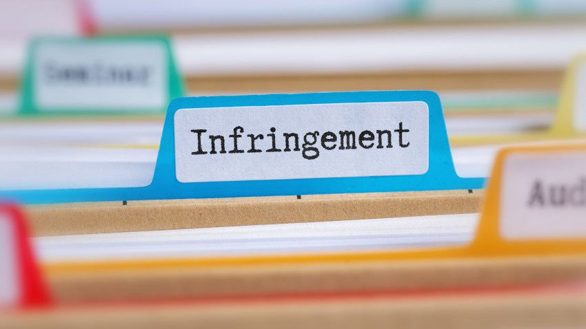 Close up on file folders tab label, reading "Infringement"