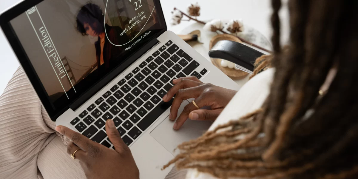 An African American business woman works on a laptop computer