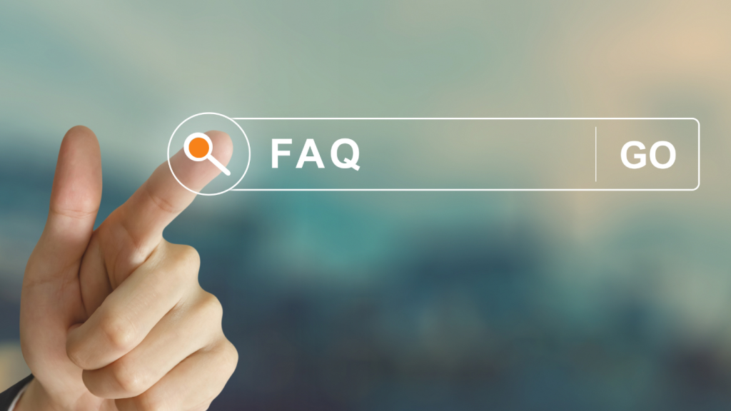 a person's hand extends the pointer finger to click on a search box's magnifying glass icon that is floating mid-photo, to initiate the search